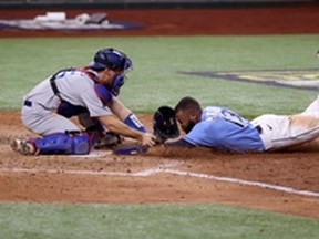 Manuel Margot of the Tampa Bay Rays is tagged out by Austin Barnes of the Los Angeles Dodgers on an attempt to steal home during the fourth inning of Game 5 of the World Series on Monday night.