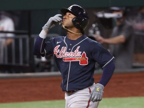 Ozzie Albies of the Atlanta Braves celebrates after hitting a solo home run against the Los Angeles Dodgers in Game 2 of the National League Championship Series at Globe Life Field on Oct. 13, 2020 in Arlington, Texas.