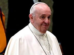 Pope Francis arrives to lead his weekly general audience in the Paul VI Hall at the Vatican, Wednesday, Oct. 21, 2020.