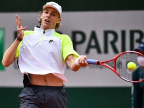 Canada's Denis Shapovalov returns the ball to Spain's Roberto Carballes Baena during the French Open in Paris on October 1, 2020.