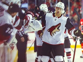 Arizona Coyotes left wing Taylor Hall (91) celebrates with teammates after scoring against the Calgary Flames at Scotiabank Saddledome.