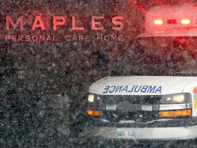 An ambulance arrives at the Maples Long Term Care Home on Mandalay Drive in Winnipeg on Monday, Oct. 26. Winnipeg Fire and Paramedic Service emergency crews spent more than four hours treating a dozen residents at an embattled personal care home in the city on Friday night with two residents passing away including one from COVID-19.