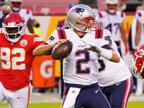 New England Patriots quarterback Brian Hoyer (2) throws a pass against the Kansas City Chiefs during the second quarter of a NFL game at Arrowhead Stadium.