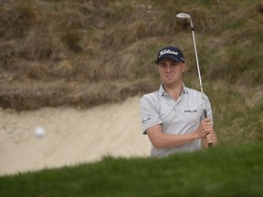 Justin Thomas hits out of the bunker on the eighth hole during the second round of the Zozo Championship golf tournament at Sherwood Country Club in Thousand Oaks, Calif.