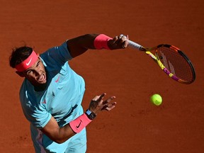 Spain's Rafael Nadal serves the ball to Sebastian Korda of the US during their men's singles fourth round tennis match on Day 8 of The Roland Garros 2020 French Open tennis tournament in Paris on Sunday, Oct. 4, 2020.