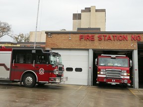 Winnipeg Fire Department equipment and personnel return to the station on Osborne Street in Winnipeg on Monday.