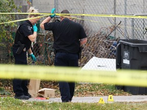 Forensics officers investigate a homicide in the 400 block of Atlantic Avenue in Winnipeg on Sunday. Gerald Justin Hamelin, a 42-year-old male of Winnipeg, was taken to hospital in critical condition where he died.