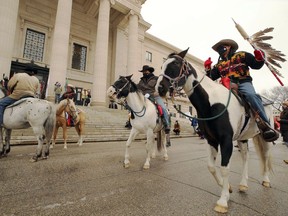 Oyate Techa Riders complete a ceremonial horse spirit ride to the steps of the Manitoba Legislative building in Winnipeg on Wed., Oct. 21, 2020, where Indigenous leaders and others expressed solidarity with Mi'kmaq fishers in Nova Scotia. Kevin King/Winnipeg Sun/Postmedia Network