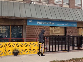 A person walks by Parkview Place personal care home on Edmonton Street in Winnipeg.