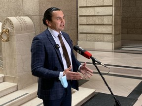 NDP leader Wab Kinew addresses the media at the Manitoba Legislature in Winnipeg on Monday. NDP and the Liberals called on the provincial government to take immediate action to stop the COVID-19 outbreak in the Parkview Place personal care home in Winnipeg.
