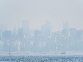 In this file photo taken on Aug. 21, 2018 shows the Vancouver skyline under heavy haze as seen from Jericho Beach.