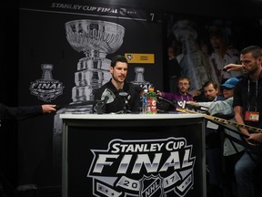 Pittsburgh Penguins' Sidney Crosby talks to reporters.