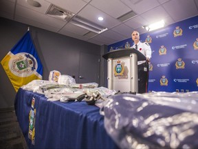 Inspector Max Waddell speaks to the media about the dismantling of an interprovincial drug network and related seized goods (including guns, $300,000 in cash, and illegal drugs like cocaine) at a press conference at the Winnipeg Police Service headquarters in Winnipeg on Thursday, Nov. 5, 2020.
Pool photo