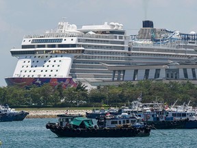 A cruise ship is docked at Marina Cruise Centre in Singapore on October 27, 2020.