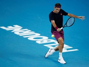 Roger Federer in action during his match against Novak Djokovic at the Australian Open, in Melbourne, Australia, Jan. 30, 2020.