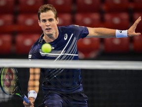 Vasek Pospisil hits a return against Richard Gasquet during the semifinal match of the ATP 250 Sofia Open in Sofia, Bulgaria, Friday, Nov. 13, 2020.