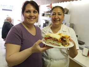 Colleen Mathez and long-time Wagon Wheel cook Fran Gomez (right) show off one of the downtown eatery's famous clubhouse sandwiches. The restaurant has been gone for almost a decade but for many Winnipeggers the Wagon Wheel Restaurant's clubhouse sandwich is still tops, Hal Anderson says.