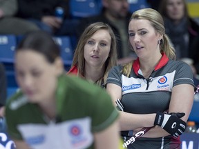 Skip Rachel Homan (left) and third Emma Miskew were on the ice at the Okotoks Ladies Classic in Alberta when they found out the event was being cancelled.