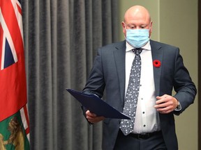 Dr. Brent Roussin, the chief provincial public health officer, arrives for a COVID-19 briefing at the Manitoba Legislative Building in Winnipeg on Wed., Nov. 4, 2020.