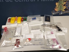 RCMP show off a haul of drugs and other items seized in a pair of raids in Winnipeg last Thursday.