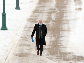 Dr. Brent Roussin, chief provincial public health officer, arrives at the Manitoba Legislative Building in Winnipeg for a press briefing on Tues., Nov. 24, 2020. Kevin King/Winnipeg Sun/Postmedia Network