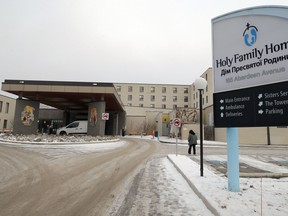 The main entrance to Holy Family Home personal care home on Aberdeen Avenue in Winnipeg is pictured on Wed., Nov. 25, 2020. The 276-bed facility is one of six PCHs experiencing a larger-scale, COVID-19 outbreak, and among 28 of the 39 the Winnipeg Regional Health Authority oversees with at least one positive case, the WRHA said Tuesday.