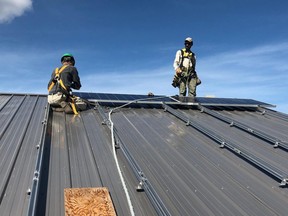 The late Randy Proven, left, and Donald Proven, right, install a solar array on Kylemore Avenue, in 2017. "How do you go about getting off natural gas? My uncle Randy used to tell me all the time, just do it," Donald said. Evan and Donald Proven established the Randy Proven Zero Carbon award with the help of Winnipeg Foundation and Passive House Canada earlier this year.
Sun Certified Builders/Handout