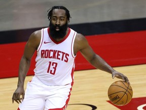 James Harden of the Houston Rockets controls the ball during the first half of a game against the San Antonio Spurs at the Toyota Center on December 17, 2020 in Houston, Texas.