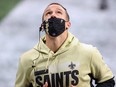 Drew Brees of the New Orleans Saints leaves the field at halftime against the Atlanta Falcons in the second quarter against the New Orleans Saints at Mercedes-Benz Stadium on Dec. 6, 2020 in Atlanta, Ga.