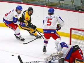 Team Manitoba's Seth Jarvis (in black and yellow jersey) is shown during the WHL Cup in 2017. Jarvis is quarantining with other Team Canada world junior hopefuls in Red Deer, Alta.