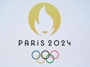 This picture taken on October 21, 2019 shows a logo during a presentation ceremony for Paris 2024 Olympic Games at the Grand Rex cinema in Paris.
