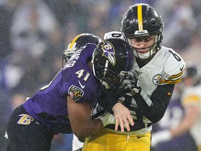 Quarterback Devlin Hodges of the Pittsburgh Steelers takes a hit from defensive back Anthony Levine of the Baltimore Ravens at M&T Bank Stadium on December 29, 2019 in Baltimore.