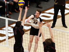 Thomas Bridle plays opposite for the Dakota Lancers, delivers a spike in the 2019 provincial tournament.