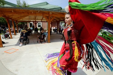 A dancer from Walking Wolf performs during a Folklorama at Home booking at River Park Gardens long-term care home on St. Anne's Road in Winnipeg on Tues., June 16, 2020. Kevin King/Winnipeg Sun/Postmedia Network