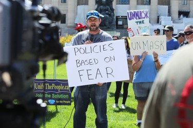 Patrick Allard of Manitoba Together speaks during a March to Unmask event in front of the Manitoba Legislative Building on Sun., July 19, 2020. Kevin King/Winnipeg Sun/Postmedia Network