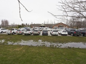 Parishioners sit in their vehicles in the parking lot at The Church of God in Aylmer, Ont., Sunday, April 26, 2020. A Winnipeg church is to find out Saturday whether it will be able to hold its own drive-in services without being fined, again, for violating COVID-19 rules.