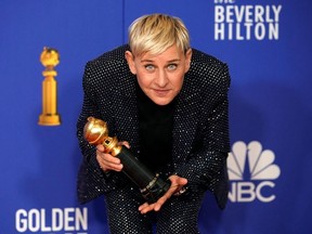 Ellen DeGeneres poses backstage with her Carol Burnett award.