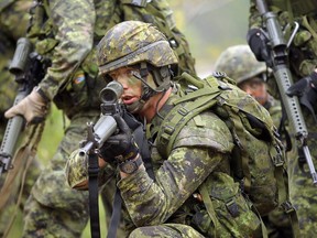 Members of the 3rd Battalion of the Royal Canadian Regiment train at CFB Petawawa on May 15, 2013.