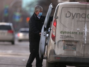 A Dynacare employee transports items away from Parkview personal care home, in Winnipeg on Tuesday, Dec. 1, 2020.
Chris Procaylo/Winnipeg Sun