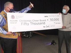 Manitoba Metis Federation President David Chartrand (right) presents $50,000 cheque to Christmas Cheer Board Executive Director Kai Madsen during a Facebook Live media event on Thursday, Dec. 17, 2020. The Manitoba Metis Federation (MMF) announced on Thursday, Dec. 17, 2020, that it increased its typical donation and will financially donate $50,000 to the Christmas Cheer Board.
For Winnipeg Sun Empty Stocking Fund.