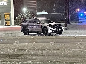 A damaged Winnipeg Police cruiser sits on Pembina Highway near Dalhousie Drive and Bairdmore Boulevard after colliding with a civilian vehicle on Sunday night. The Independent Investigation Unit of Manitoba is conducting an investigation.