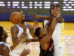 Kyle Lowry of the Toronto Raptors has a shot blocked by Draymond Green of the Golden State Warriors at Chase Center on Sunday night.