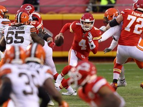 Not known for his running ability, quarterback Chad Henne #4 of the Kansas City Chiefs scrambles against the Cleveland Browns late in the fourth quarter of their AFC Divisional playoff game at Arrowhead Stadium on January 17, 2021 in Kansas City, Missouri.