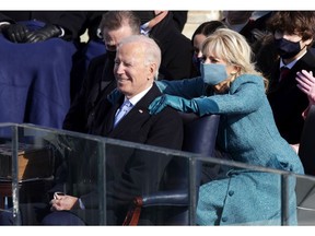 First Lady Dr. Jill Biden embraces U.S. President Joe Biden after his inaugural address at the U.S. Capitol.