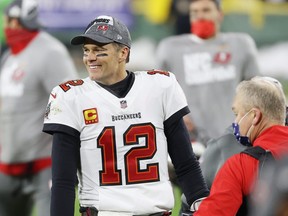 Tom Brady #12 of the Tampa Bay Buccaneers celebrates their 31-26 win over the Green Bay Packers during the NFC Championship game at Lambeau Field.