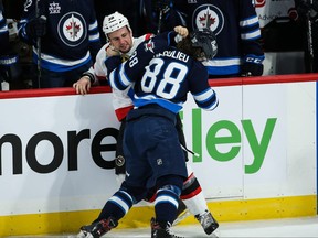 Winnipeg Jets defenceman Nathan Beaulieu (88) fights Ottawa Senators forward Michael Haley during the first period at Bell MTS Place.