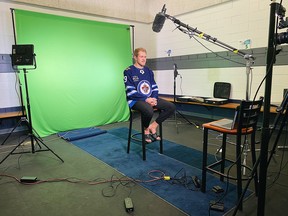 Winnipeg Jets forward Andrew Copp sits during a production session on the first day of training camp on Sunday. The team will hold their first on-ice session Monday. Photo by Tyler Esquivel/ Winnipeg Jets