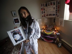 ONE TIME USE ON JAN. 29, 20201 ONLY

Christie Zebrasky, whose daughter Eishia Hudson was shot dead by police on April 8, 2020, is photographed in her bedroom with her daughter's ashes and memorial in Winnipeg, Friday, December 11, 2020.  THE CANADIAN PRESS/John Woods