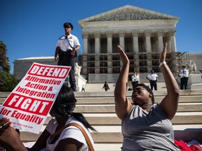Students protest in support of affirmative action, outside the Supreme Court during the hearing of "Schuette v. Coalition to Defend Affirmative Action" on Oct. 15, 2013 in Washington, D.C.