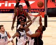 Raptors’ Kyle Lowry (right) shoots over Dallas’ Willie Cauley-Stein at Amalie Arena in Tampa last night. The Raptors won 116-93.  Mike Ehrmann/Getty Images